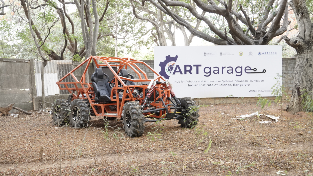 Red AdbhutBot prototype standing in Artgarage makers space of IISC Bangalore.
