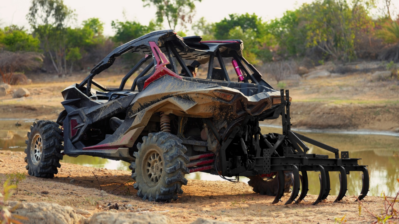 Ashva 4x4 all terrain vehicle with four-wheel drive and plow attachment,